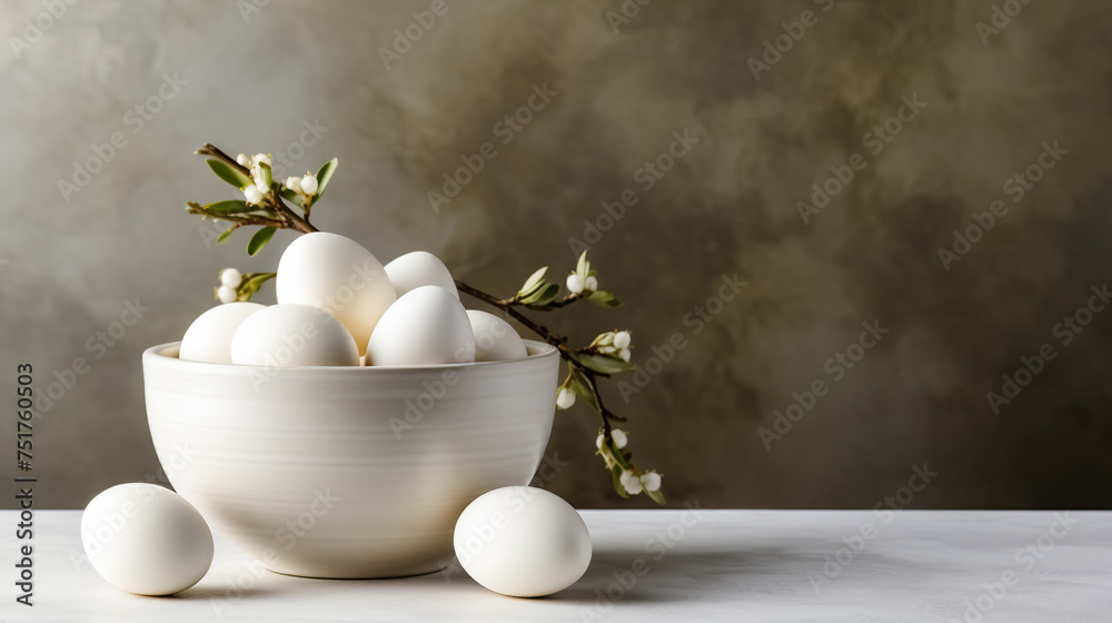 Easter composition with white eggs in a bowl on a gray background. Greeting card on an Easter theme. Happy Easter concept.