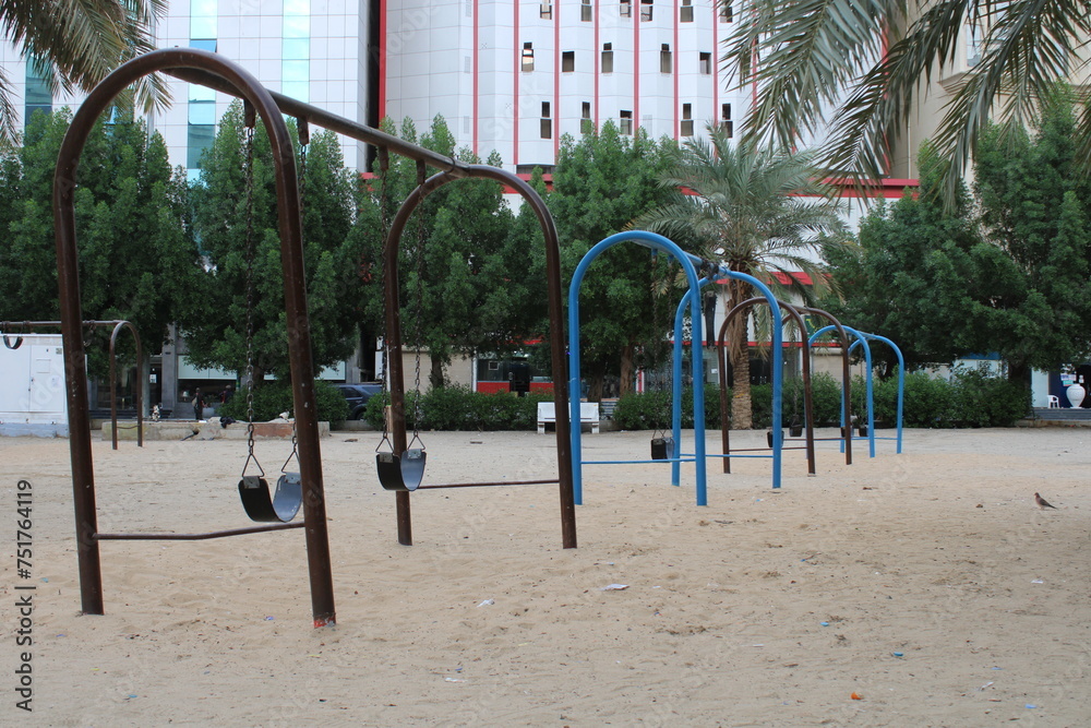 a playground in the back streets of mecca. old swings in the playground
a playground in the back streets of mecca. old swings in the playground