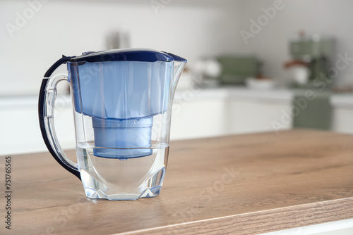 Blue water filter jug on ta...