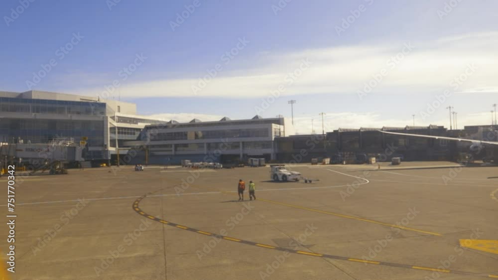 May 24, 2021 - Vancouver, British Columbia, Canada. The view as a passenger as a plane begins to prepare for takeoff and ground crew clear the area. May 24, 2021 - Vancouver, British Columbia, Canada. The view as a passenger as a plane begins to prepare for takeoff and ground crew clear the area.