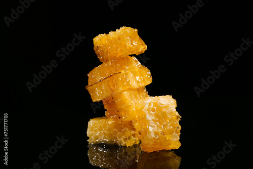 Many sweet honeycombs on black background