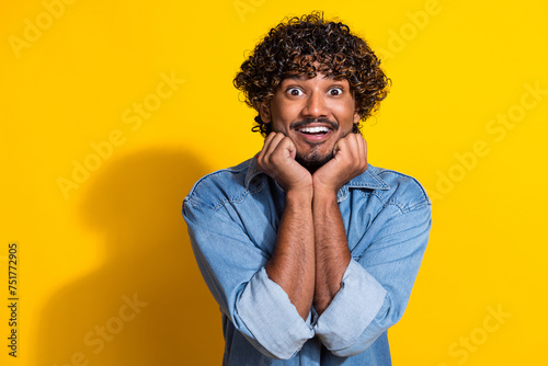 Photo portrait of handsome young guy excited dreamy cute pose dressed stylish jeans garment red scarf isolated on yellow color background