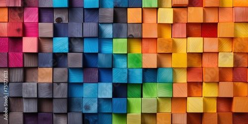 Spectrum of colorful wooden blocks aligned on a rustic old wood table. Japanese Color set. Background or cover for something creative  diverse  and in multiple variations.