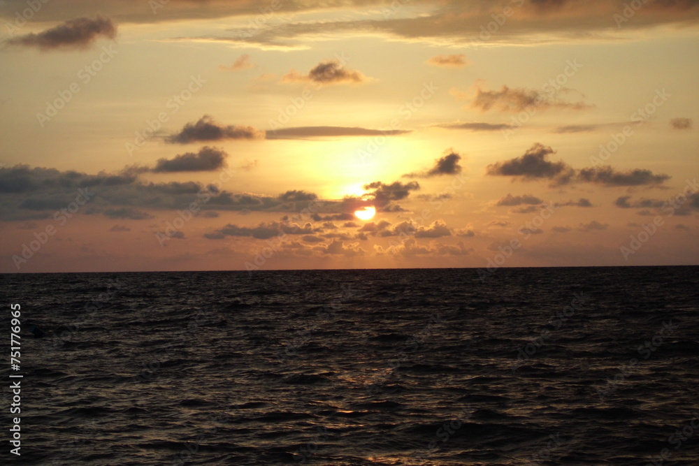 sunset at sea with clouds