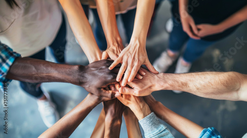 Overhead View of Diverse Hands Together in a Teamwork Gesture