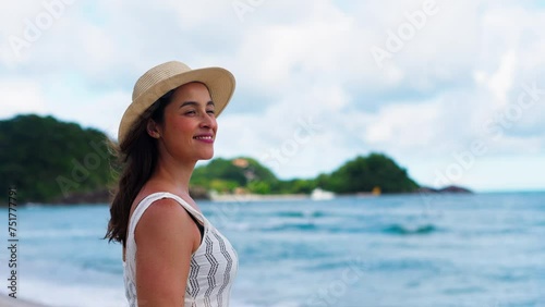 Wallpaper Mural Happy young white woman wearing hat feeling the sea breeze. Beautiful smiling girl relaxing and enjoy the sun at seaside. 
 Torontodigital.ca