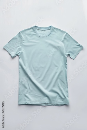 blue color t-shirt lying on a white background