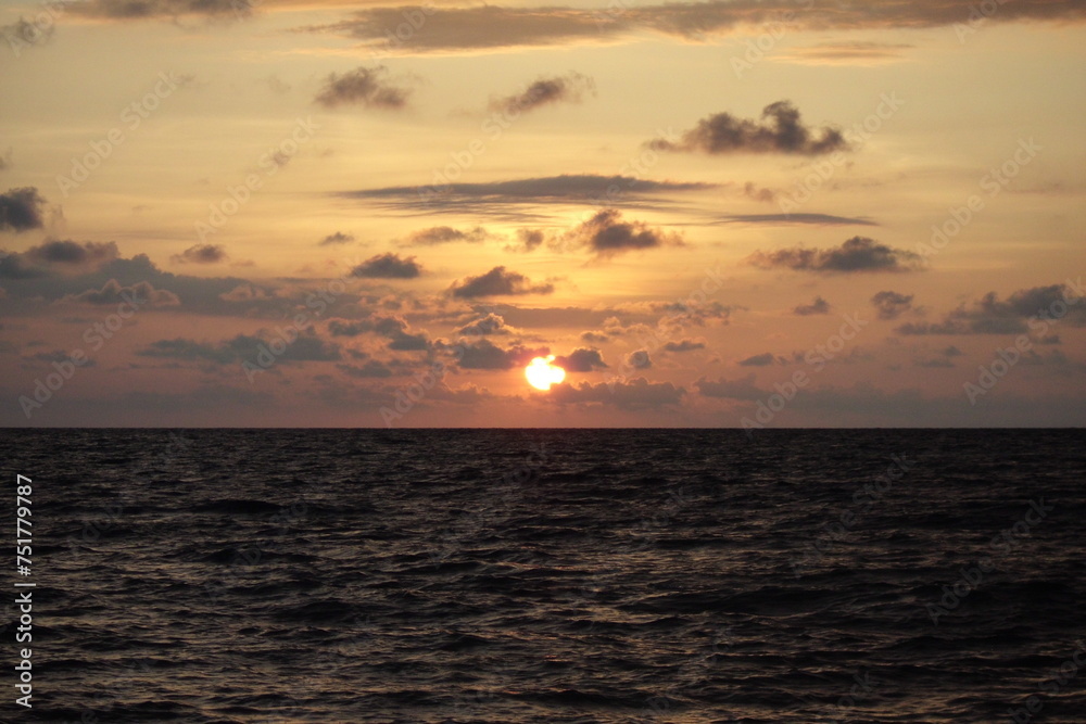 sunset at sea with clouds