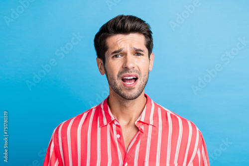 Photo of shocked impressed man dressed striped shirt open mouth isolated blue color background