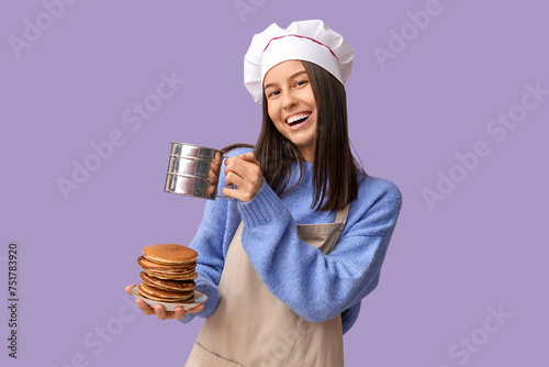 Young female chef with tast...