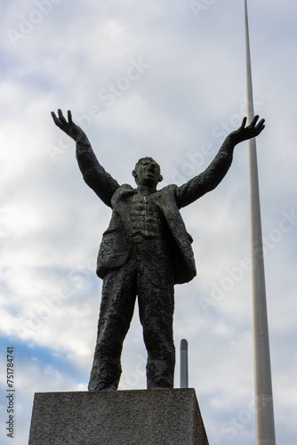 Dublin, Ireland; August 9, 2023:  Jim Larkin sculpture, The Spire, 120 meter high stainless steel column, which is a symbol of the city. An Post, General Post Office photo