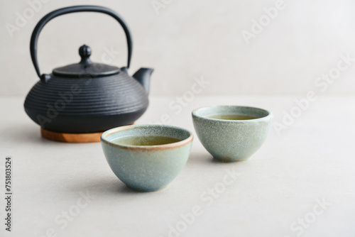 two ceramic cups of green tea