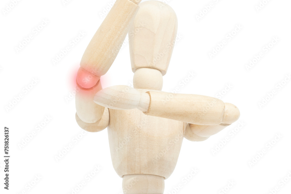 A wooden mannequin pointing to an elbow pain with a red dot. Concept of pain. Lateral or medial epicondylitis. Cubital tunnel syndrome. A wooden mannequin pointing to an elbow pain with a red dot. Concept of pain. Lateral or medial epicondylitis. Cubital tunnel syndrome.