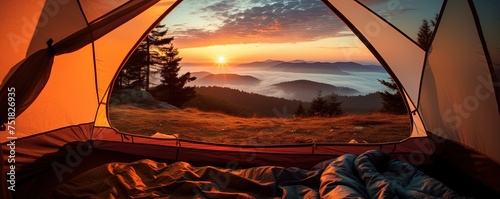 View of the serene landscape from inside a tent. Camping at campsite with sleeping bags. Stunning sunrise