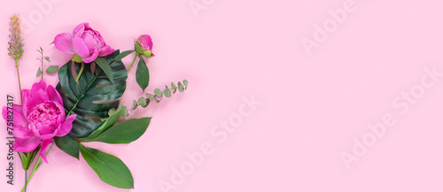 Bouquet of beautiful peonies on pink  paper background. Creative spring concept. Festive greeting card.