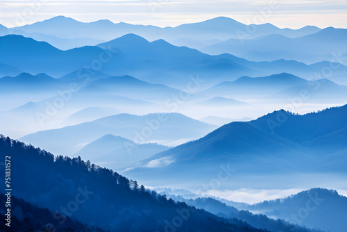 Blue Monochromatic Wonder: Spectacular Cascade of Foggy Mountains under Overcast sky