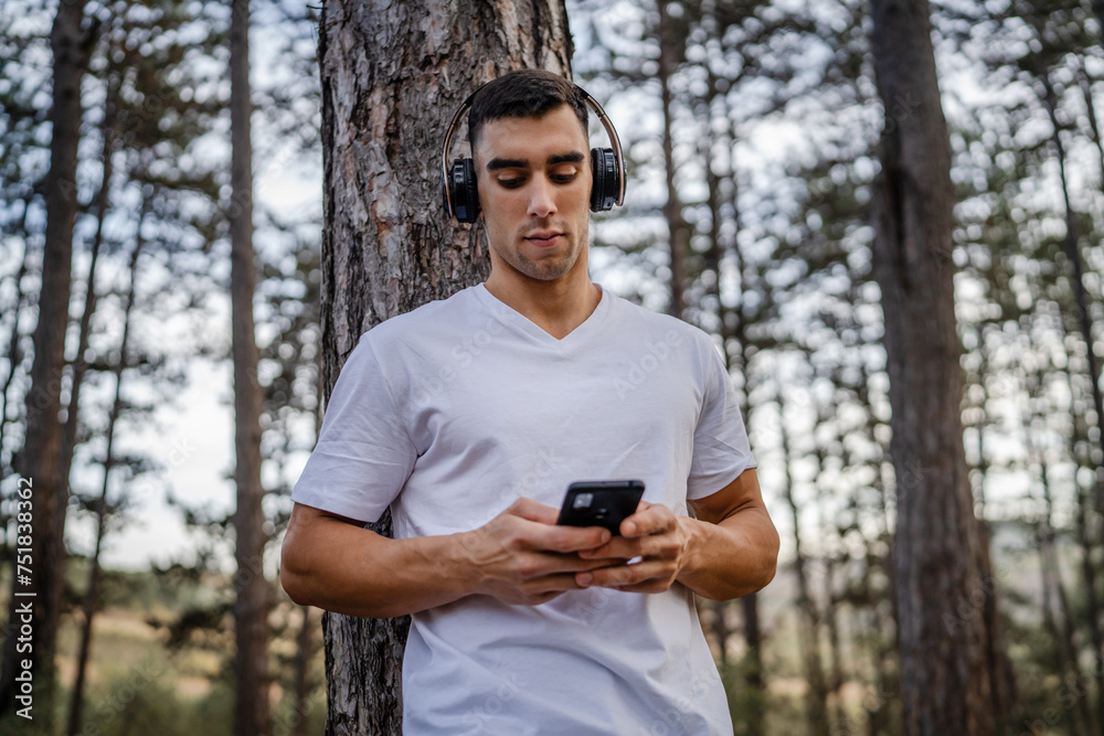 man use mobile phone smartphone during training man use mobile phone smartphone during training