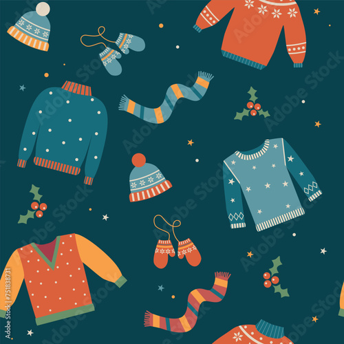 Christmas winter woollen seamless pattern with hats, jumpers, scarf,  gloves and berries on blue background. 