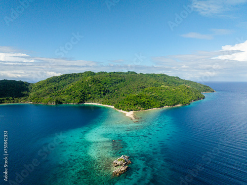 Fototapeta Naklejka Na Ścianę i Meble -  Top view of Blue sea and Alad Island with small white beach. Romblon, Philippines.
