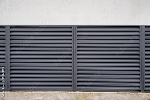 Modern metal profile fence with shutters or blinds