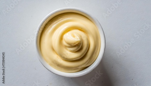 top view on a cup of mayonnaise on white background
