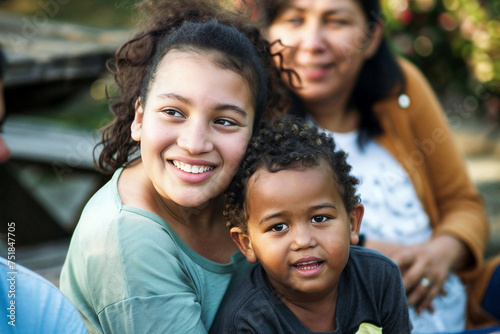 Candid capture of a diverse South American family sharing a moment of laughter and togetherness, embodying the simplicity and pleasure of life surrounded by love.