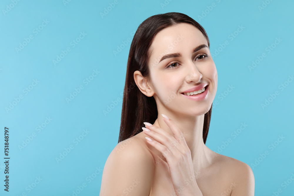 Portrait of beautiful young woman on light blue background. Space for text Portrait of beautiful young woman on light blue background. Space for text