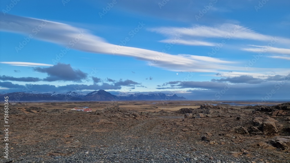 Majestic roadside landscape in arctic countryside with farmlands and snowy hilltops in distance, icelandic natural scenery. Spectacular wilderness in nordic environment, scenic route.