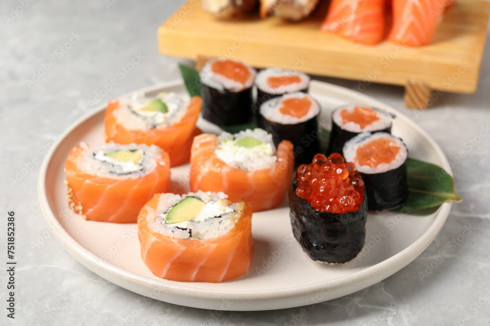 Delicious sushi rolls on white background, closeup Delicious sushi rolls on white background, closeup