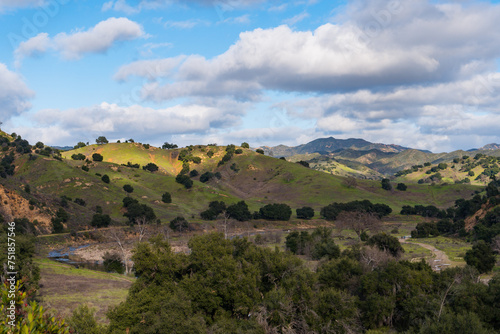 Views mountains, hills, rivers, lush grass and foliage, while hiking during the spring in Malibu Creek State Park.