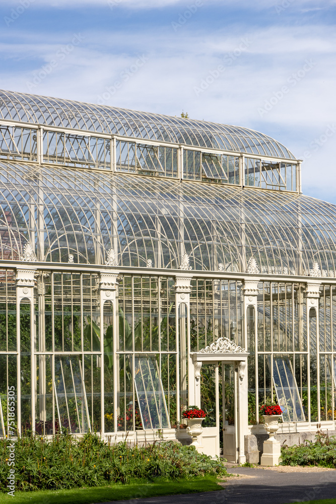 Beautiful greenhouse in National Botanic Gardens, Dublin, Ireland. Large area with naturalist sections, formal gardens, an arboretum and a greenhouse with Victorian palms. Beautiful greenhouse in National Botanic Gardens, Dublin, Ireland. Large area with naturalist sections, formal gardens, an arboretum and a greenhouse with Victorian palms.