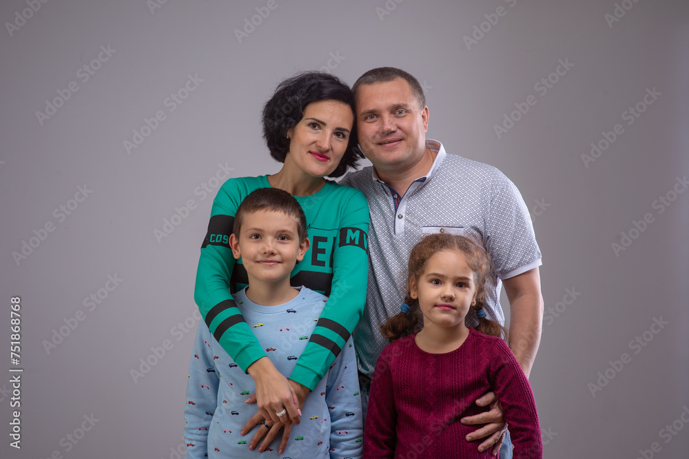 studio portrait of a happy family husband wife daughter and son 8