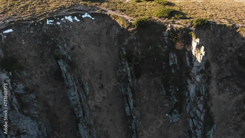 Hikers near the dangerous cliffs. 