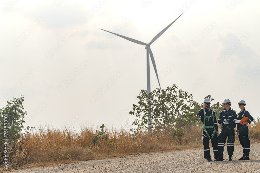 custom made wallpaper toronto digitalEngineers man and woman inspecting construction of WIND TURBINE FARM. WIND TURBINE with an energy storage system operated by Super Energy Corporation. Workers Meeting to check AROUND THE AREA.