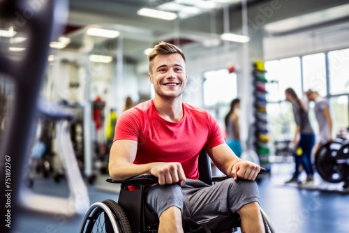 A cheerful young man in a wheelchair in an inclusive gym. Concept of athletic spirit and the importance of accessibility in fitness spaces for individuals, people with disabilities