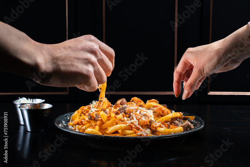 sharing fries with cheese photo