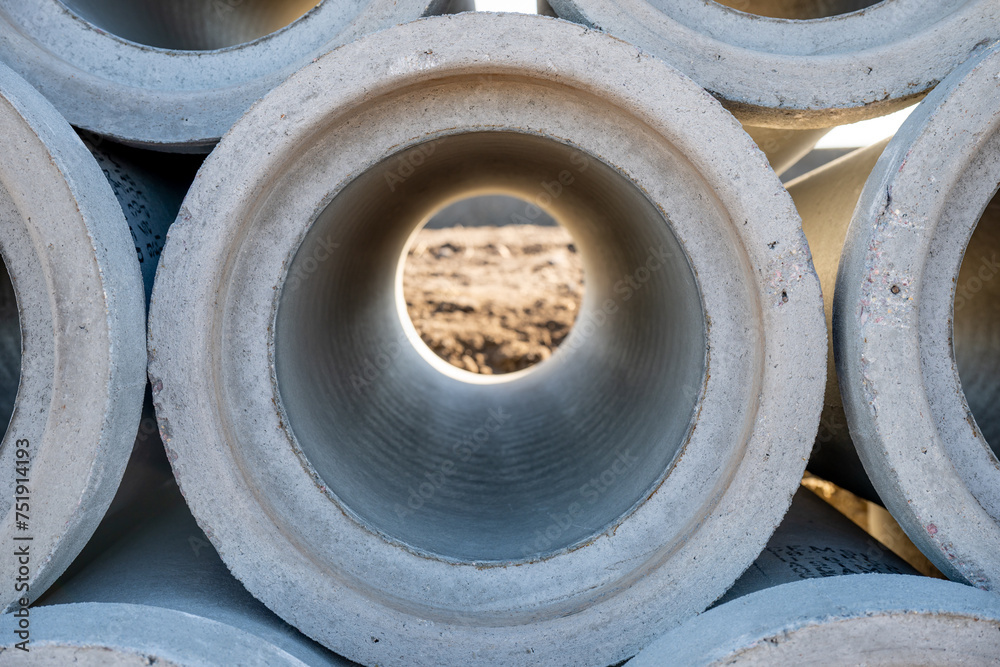 Concrete pipes with center hole resemble automotive tires