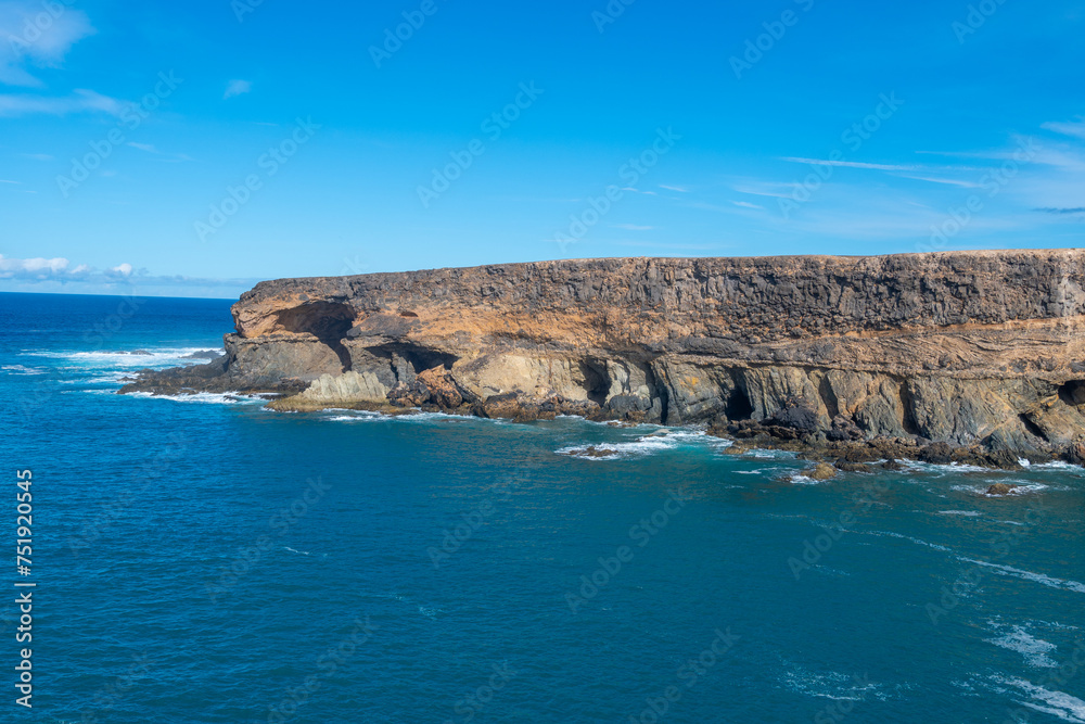 West coast of Fuerteventura island. View on blue water and black caves of Ajuy village, Canary islands, Spain.
