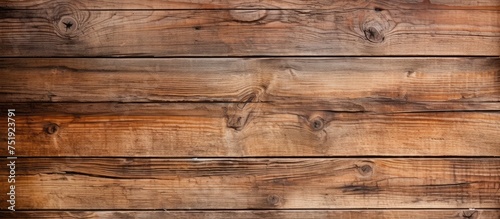 Detailed view of a weathered wooden plank wall, showcasing unique patterns and textures. The aged wood gives a vintage aesthetic, perfect for backgrounds or rustic interiors.