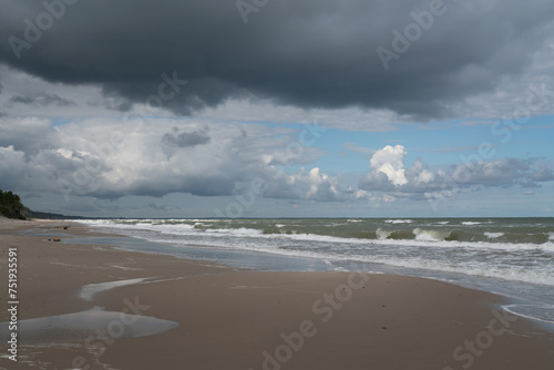 Fototapeta Naklejka Na Ścianę i Meble -  View of the incoming wave on the Baltic Sea on the shore of the Curonian Spit on a summer day, Kaliningrad region, Russia