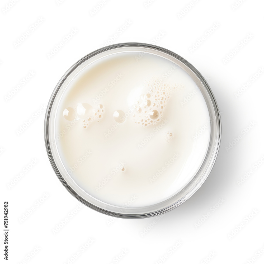 Glass of milk with bubbles isolated on white top view Glass of milk with bubbles isolated on white top view