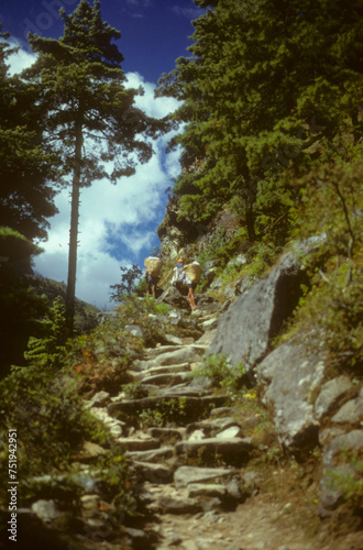 Porters on steep trail