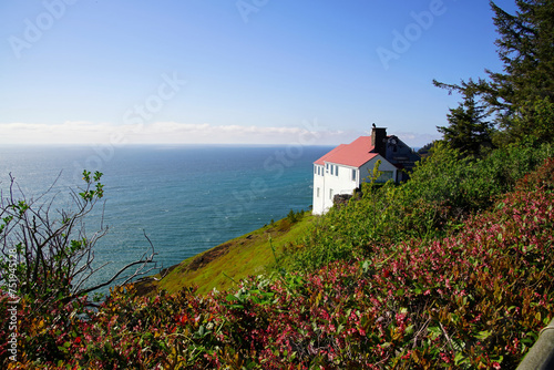 White house on cliffs of Cape Foulweather photo