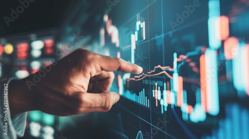Businessman hand pointing finger to growth success finance business chart. analyzing investment and financial trading data in candlestick chart on a touch screen interface. © Pro Hi-Res
