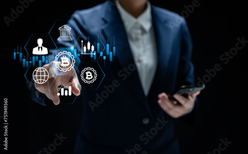 Businesswomen point to cryptocurrency graphs on a virtual screen of bitcoin currency, financial and investment platform digital, security and .digital network, blockchain concept.