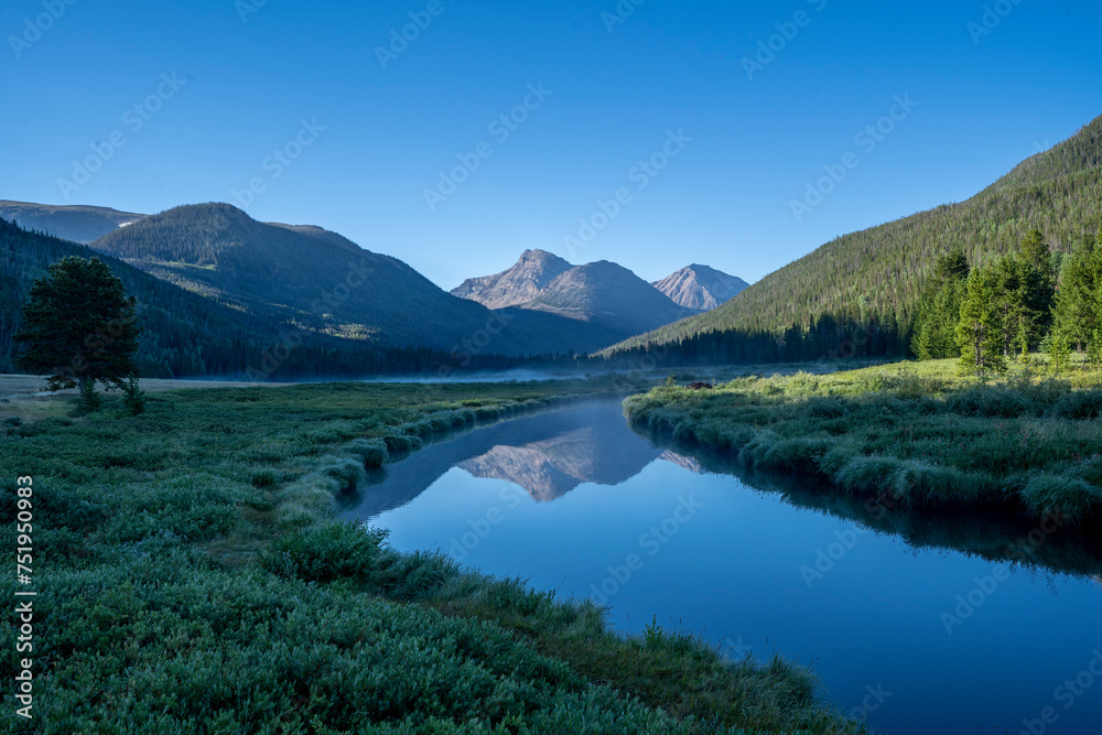 Naklejka premium Rocky Mountain meadow with river reflection in Utah