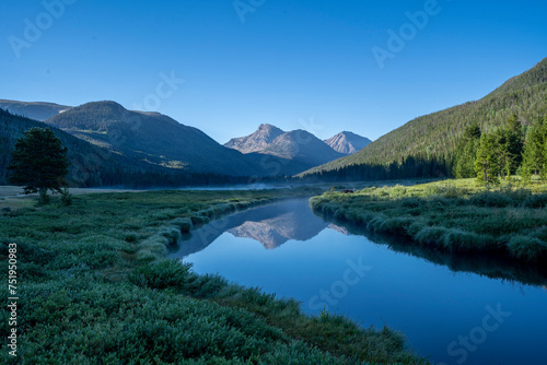 Rocky Mountain meadow with river reflection in Utah