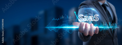 SAAS: Businessman Holding SaaS Icon and Global Network with Analyzing Technological Data, Cloud Computing, Network Connection on Interface Background, Digital Transformation, Seamless Integration.