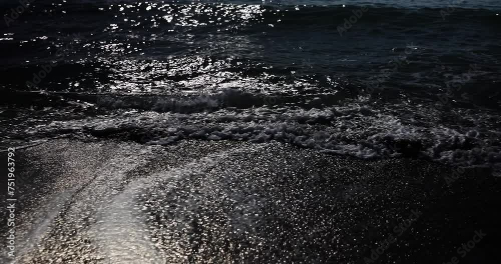 Splashing wave on the sea at night Splashing wave on the sea at night