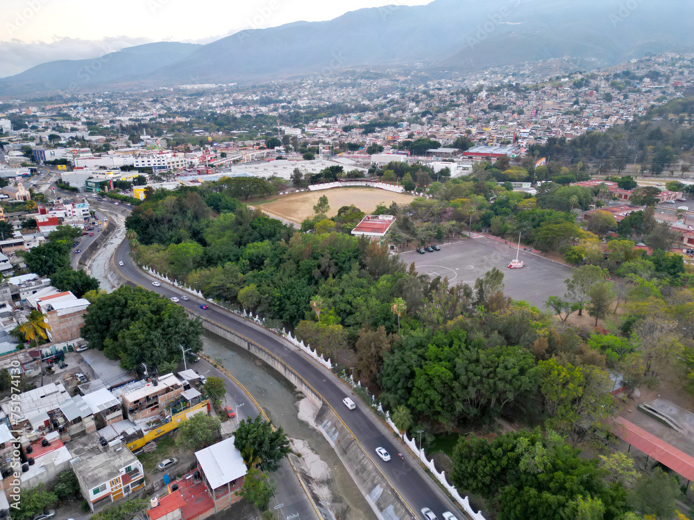 Expansive aerial shot showing the cityscape of Chilpancingo with the winding Huacapa River, captured horizontally